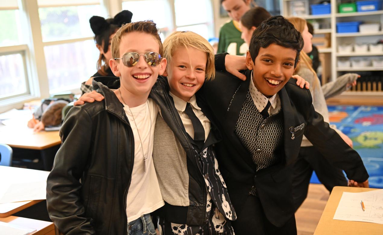 A trio of Grade 5 students in Halloween costumes