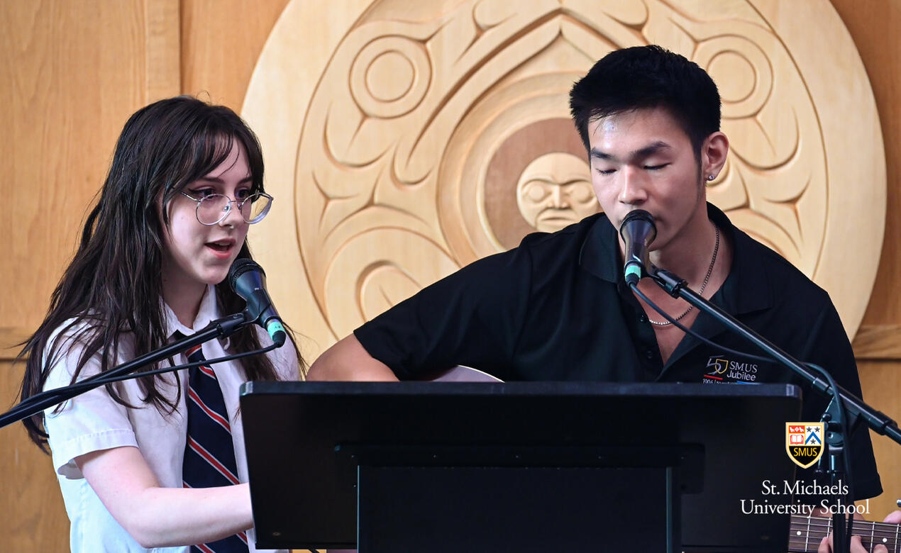 Grade 12 students Haley and Will perform in the chapel