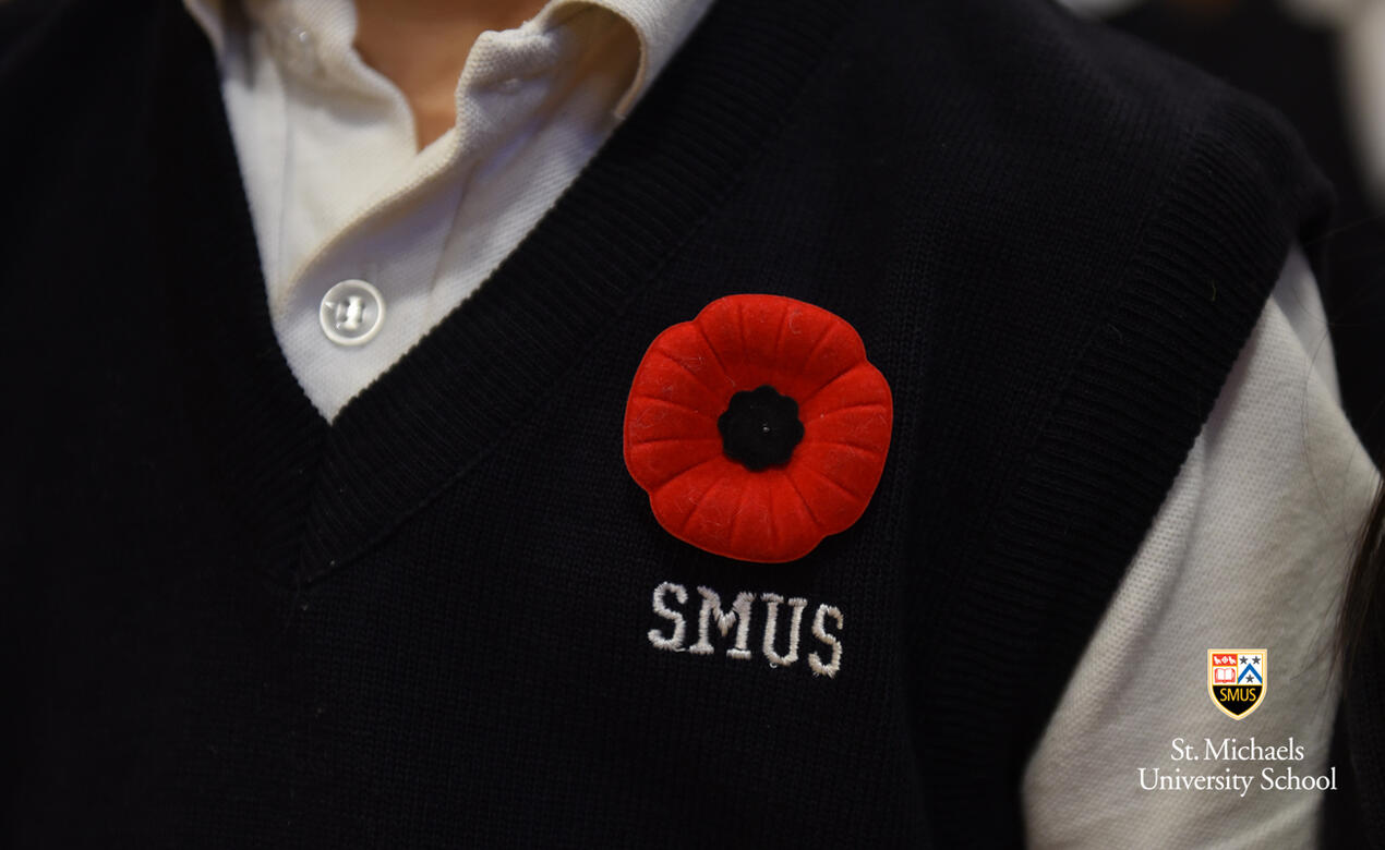 A student wears a poppy on Remembrance Day