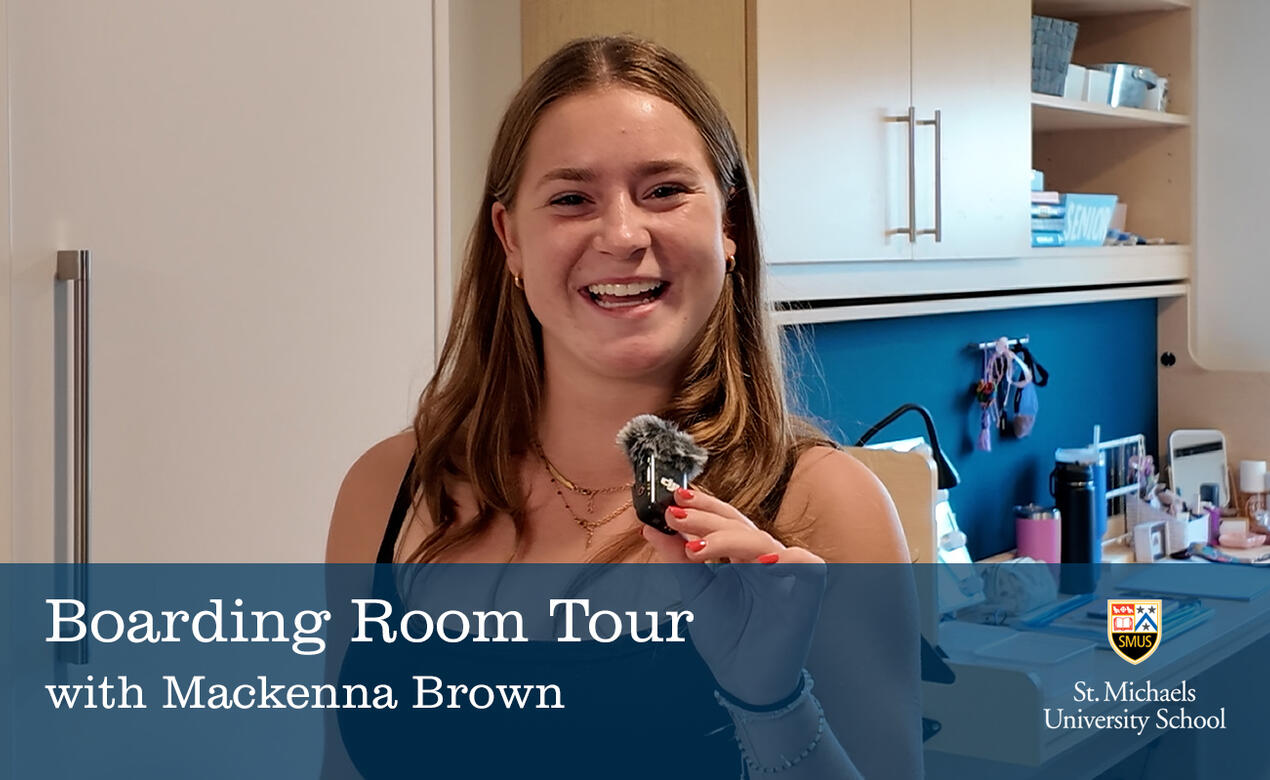 Mackenna Brown smiles while giving a room tour