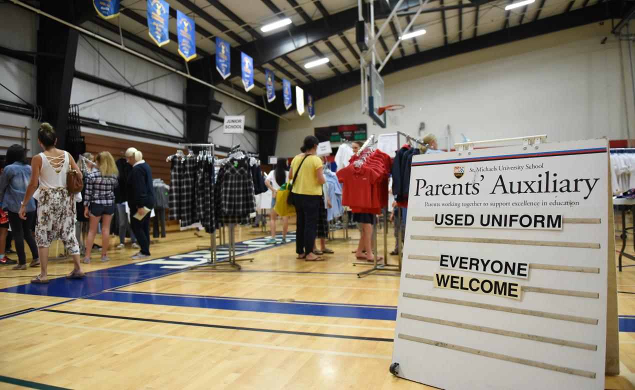 Parents' Auxiliary Uniform Sales in the single gym