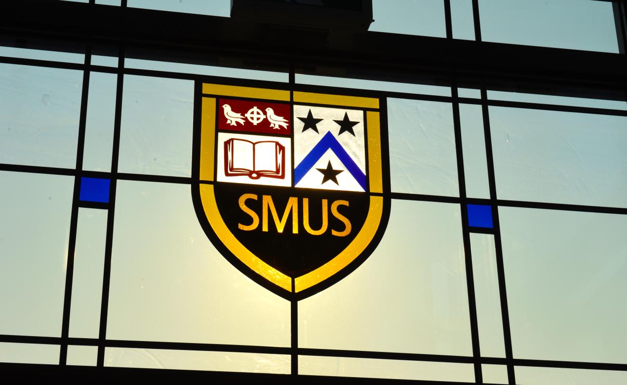 SMUS crest in stained glass