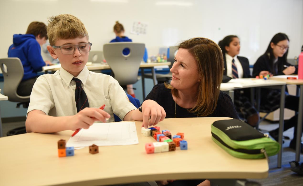 Middle School student and teacher in the classroom