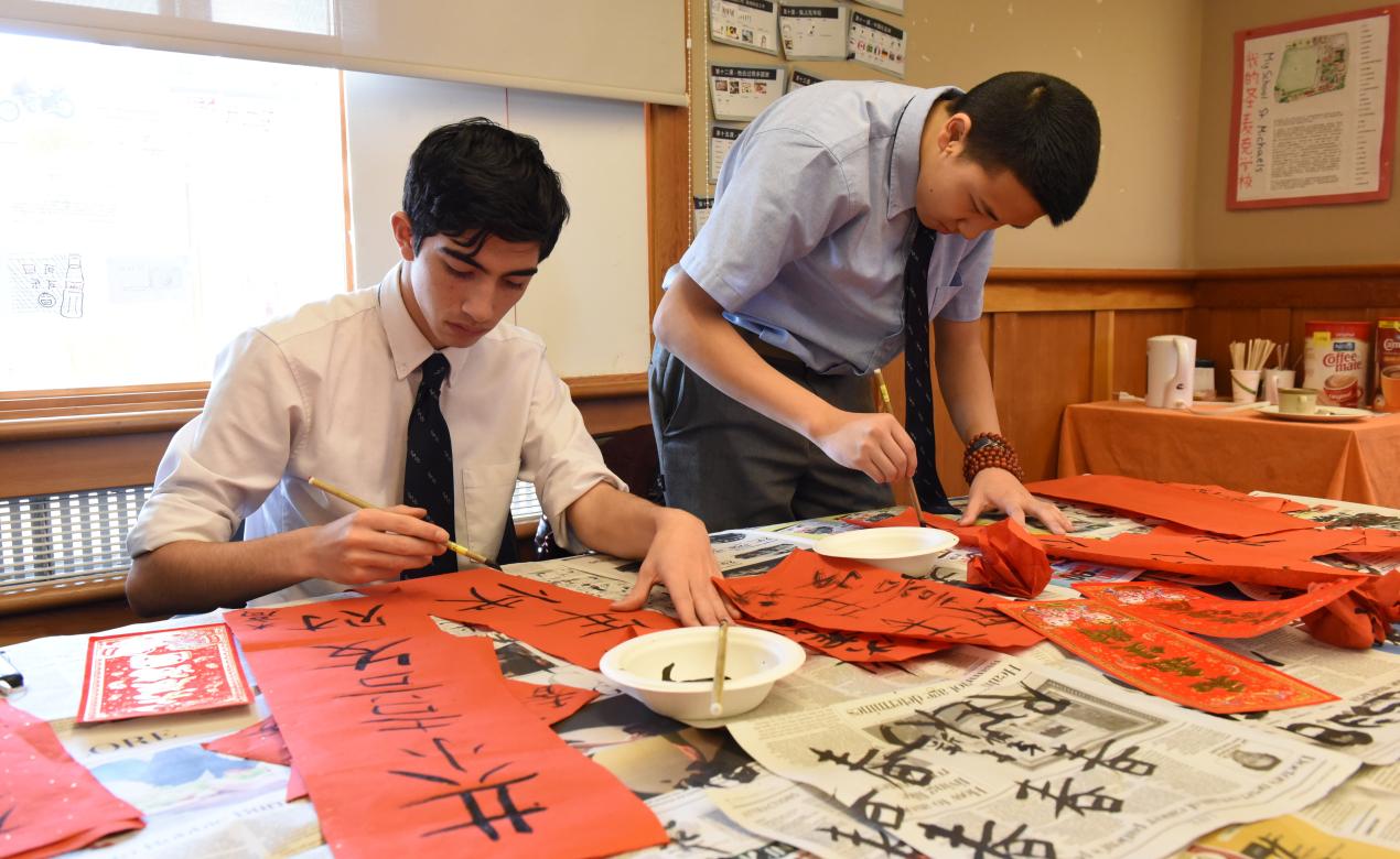 Senior School students trying their hand at Chinese calligraphy