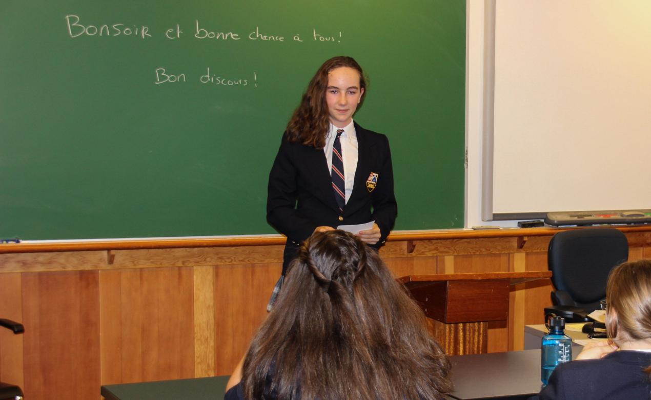 Senior School student giving a presentation in French class