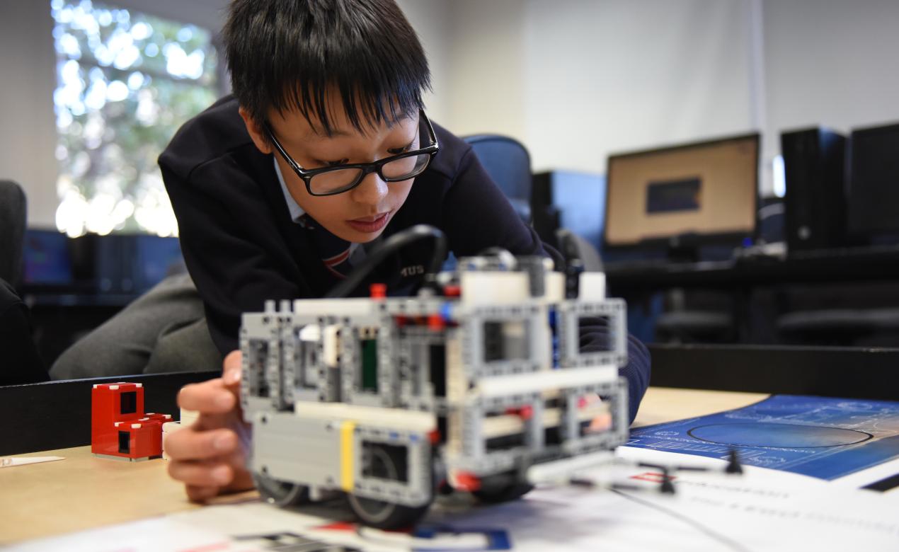 Middle School student working on a LEGO robotics project