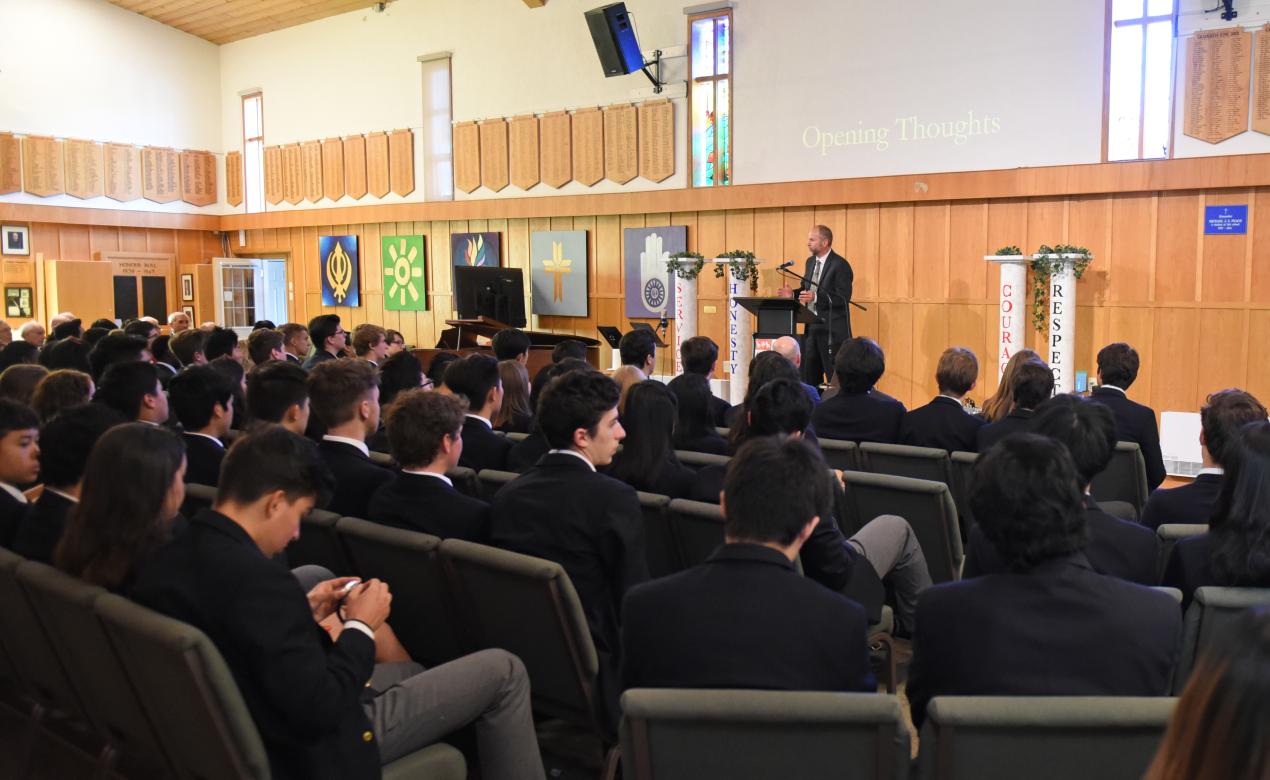 Rev. Keven Fletcher speaks to Grade 12 students during a chapel gathering.