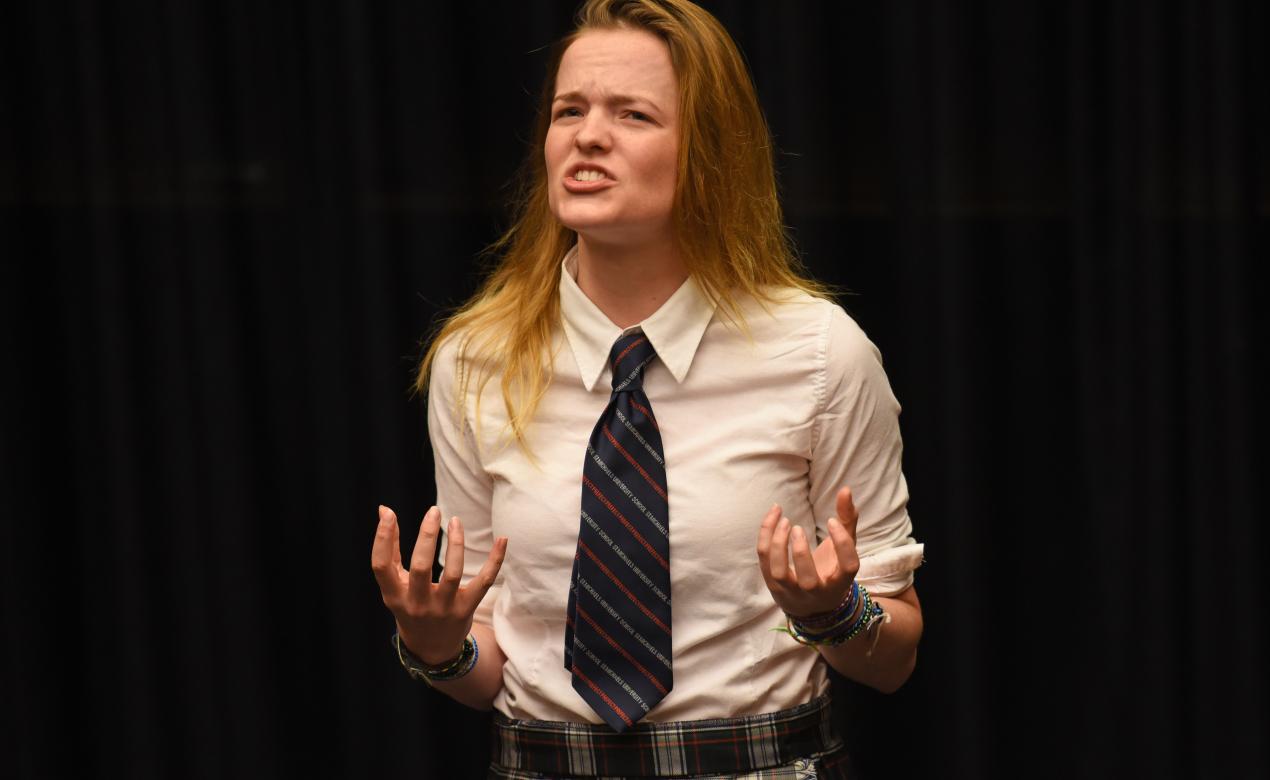 A Senior School student passionately performs spoken word poetry