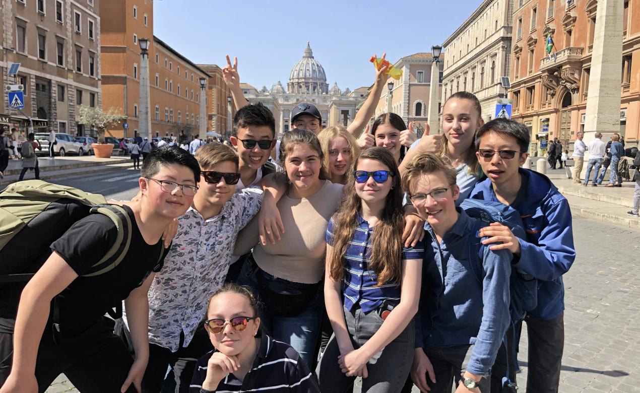 Students pose for a photo during a Spring Break music trip in Europe.