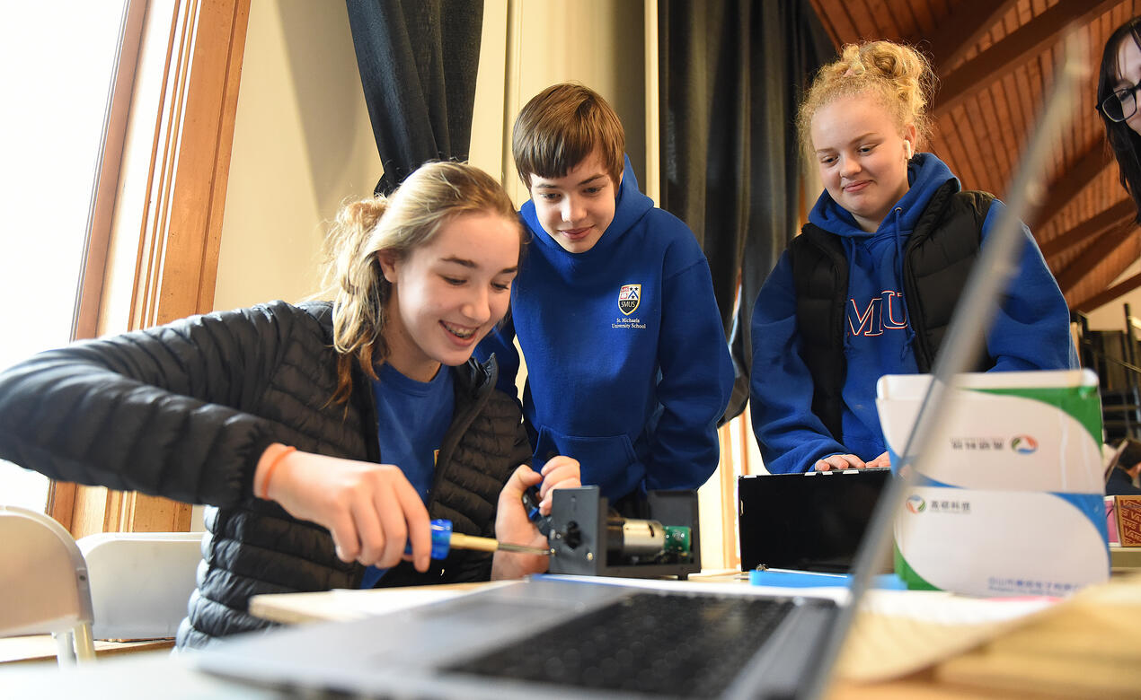 Students working on a device