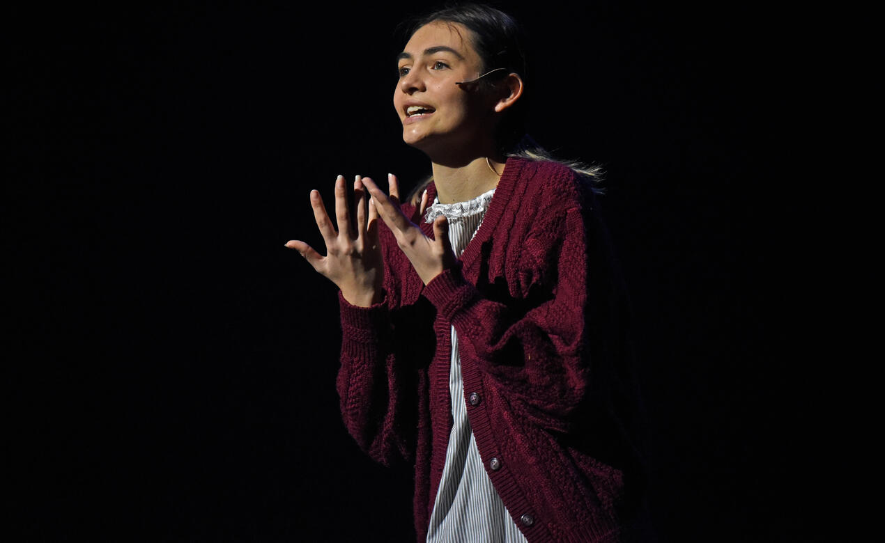 A Senior School student performs a song from the musical Annie during the 2022 musical, SMUS Revue '22.