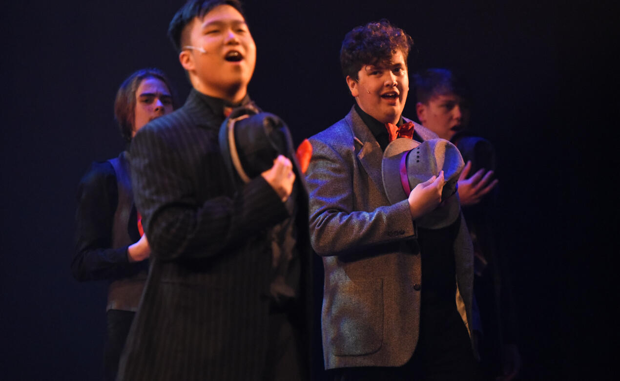 Senior School students perform a song from the musical Guys and Dolls during the 2022 musical, SMUS Revue '22.