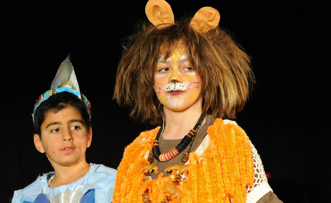 Students perform as character from The Lion King during the Grade 5 musical