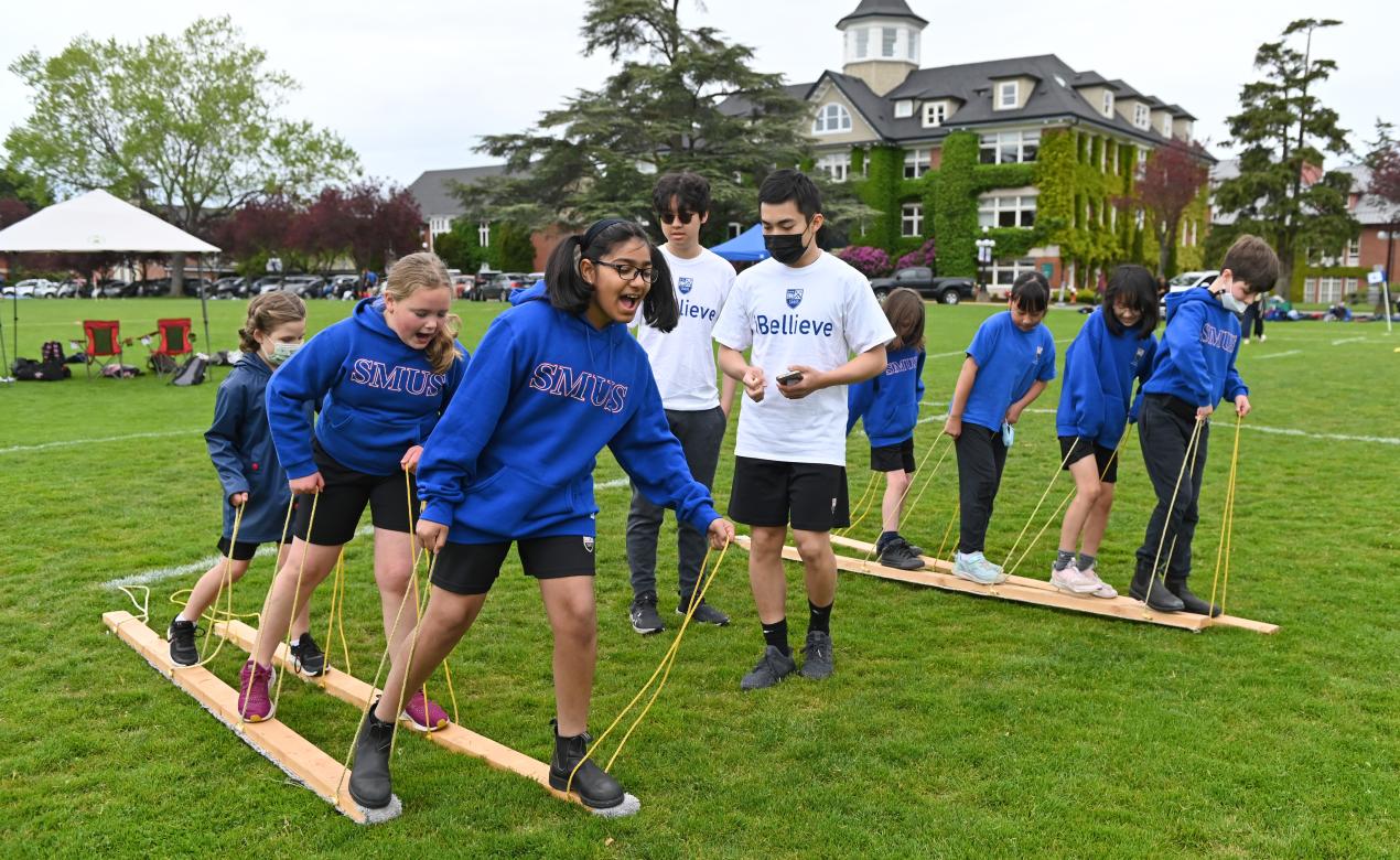 Junior School students work together on a game, led by Senior School students, during the iBellieve Right to Play event.