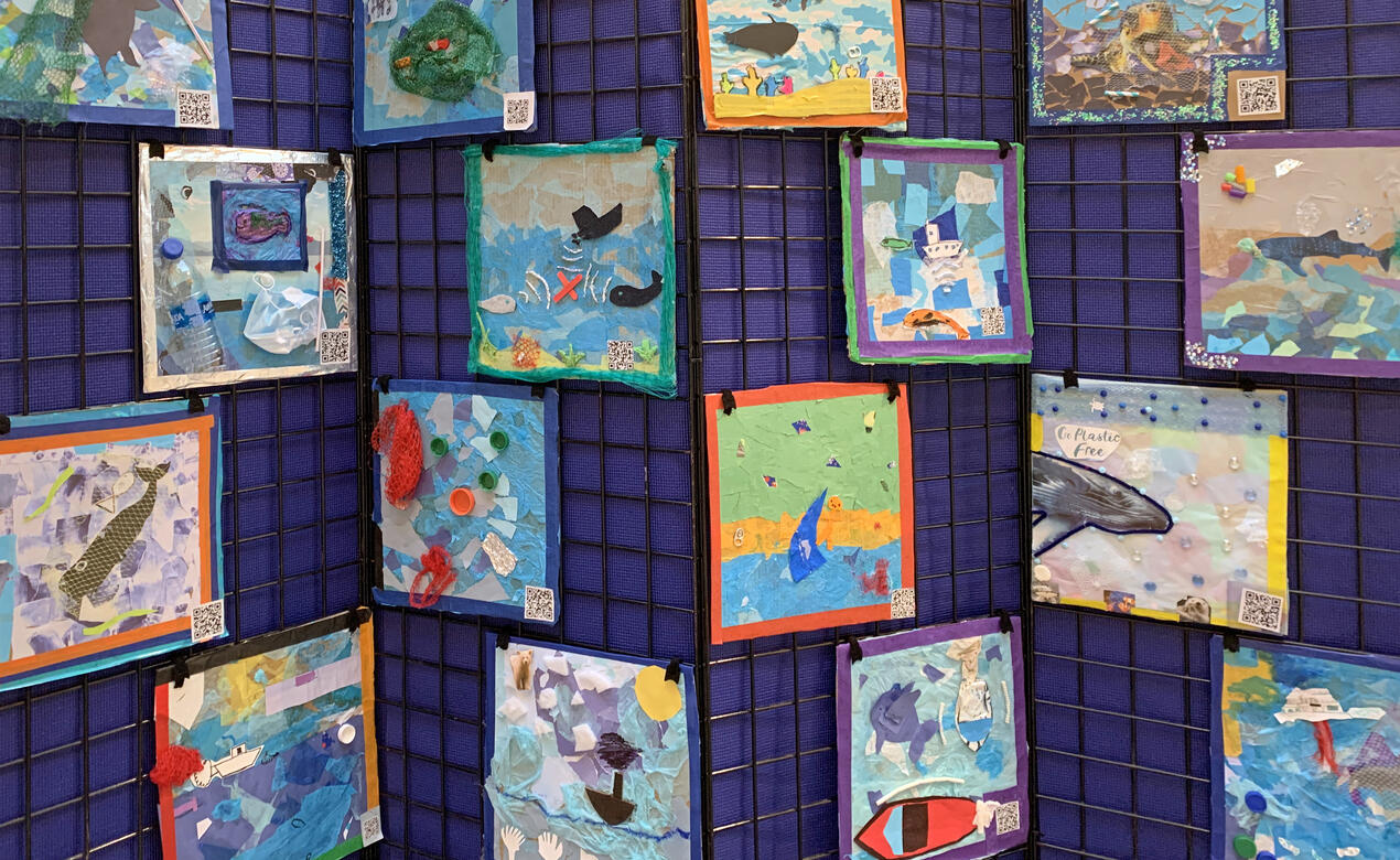 Posters made by Grade 4 students that depict a variety of ocean threats on display at Hillside Shopping Centre.