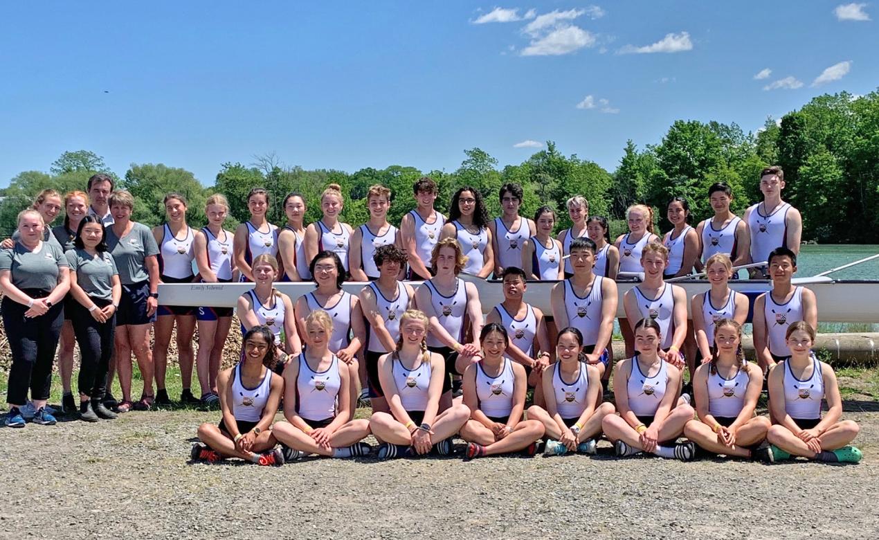 The SMUS Rowing team poses with the new Emily Selwood boat in St. Catharines, Ontario, ahead of nationals.