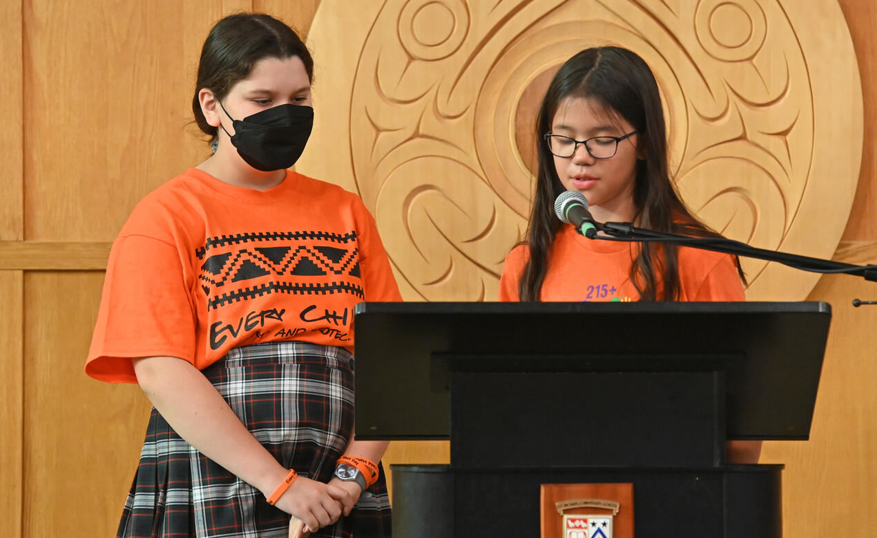 Two Middle School students speak in the chapel during the National Day for Truth and Reconciliation ceremony.