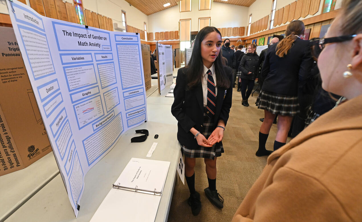 Middle School student Sonia presents her science fair project