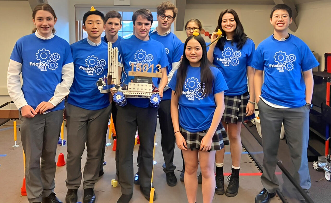 The Senior School Robotics Team poses with its robot