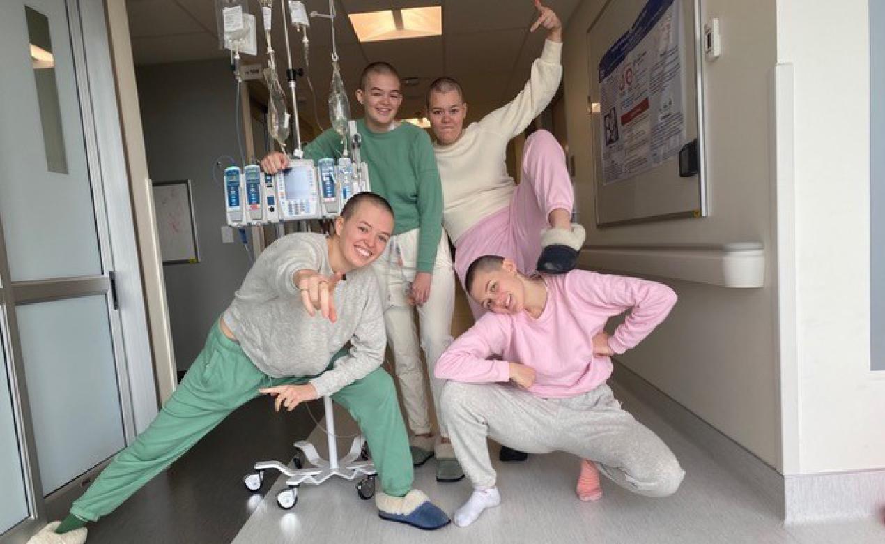 A photo of alum Willow Irving in hospital alongside her sisters