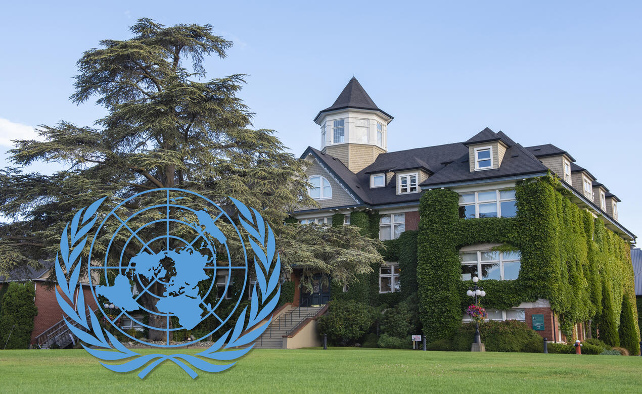The UN logo superimposed on a photo of School House