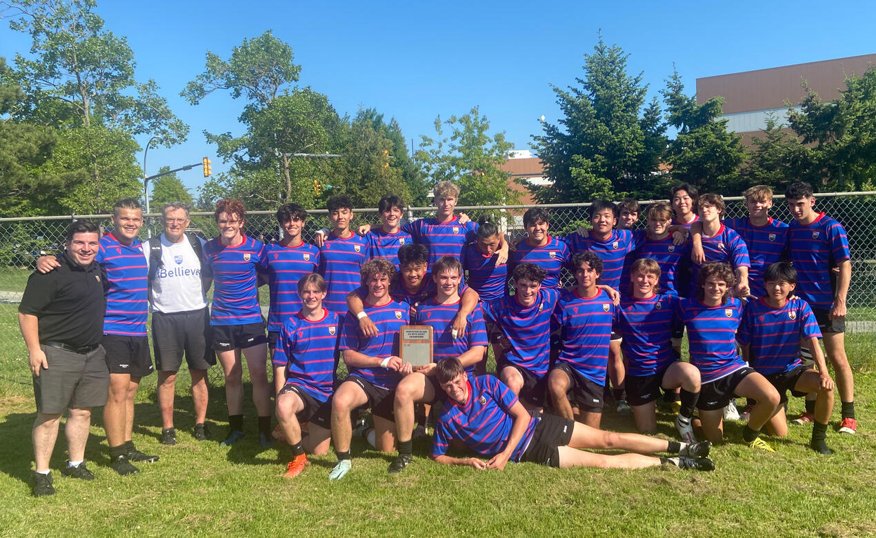 Senior Boys Rugby team pose with their trophy