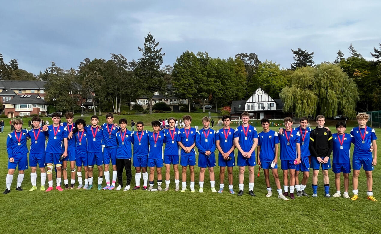 Our Senior Boys Soccer team with medals