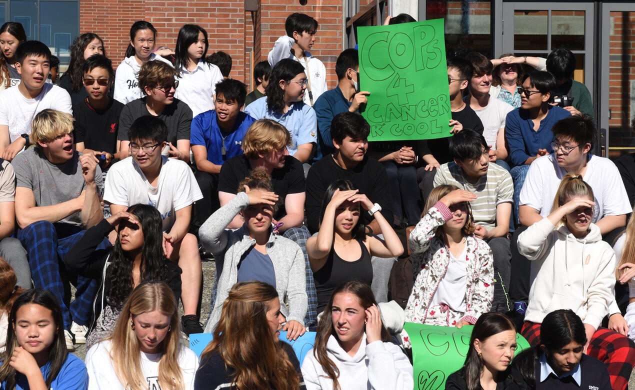 Students gather to welcome the Cops for Cancer riders