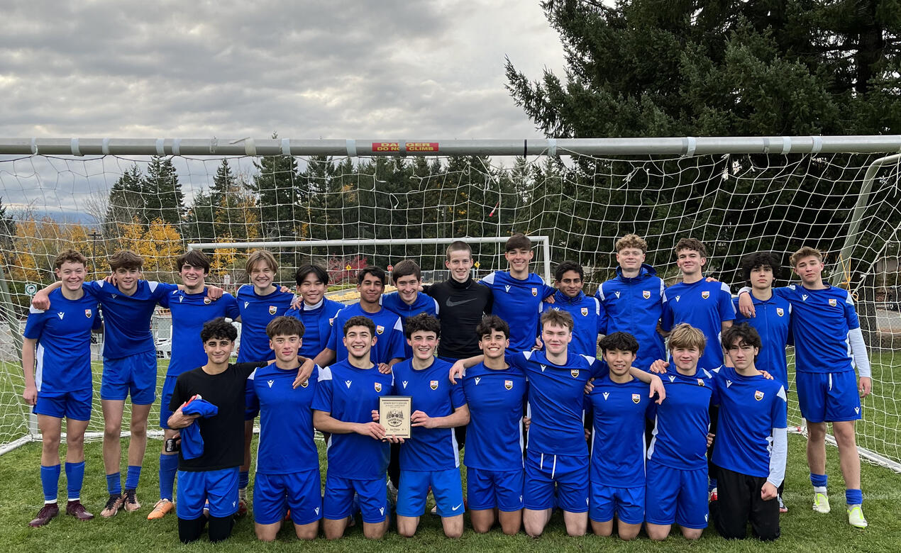 Our Senior Boys Soccer team with the third place trophy