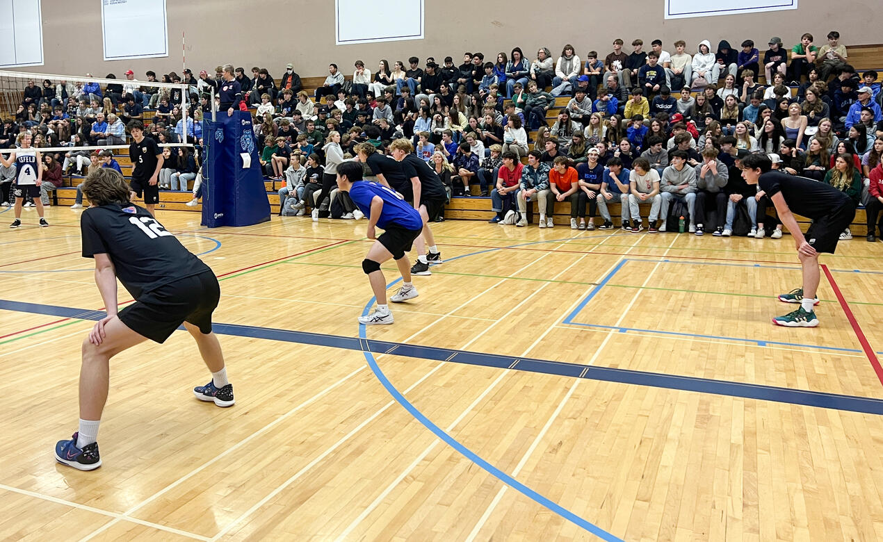 Our Senior Boys Volleyball team prepare to receive a serve