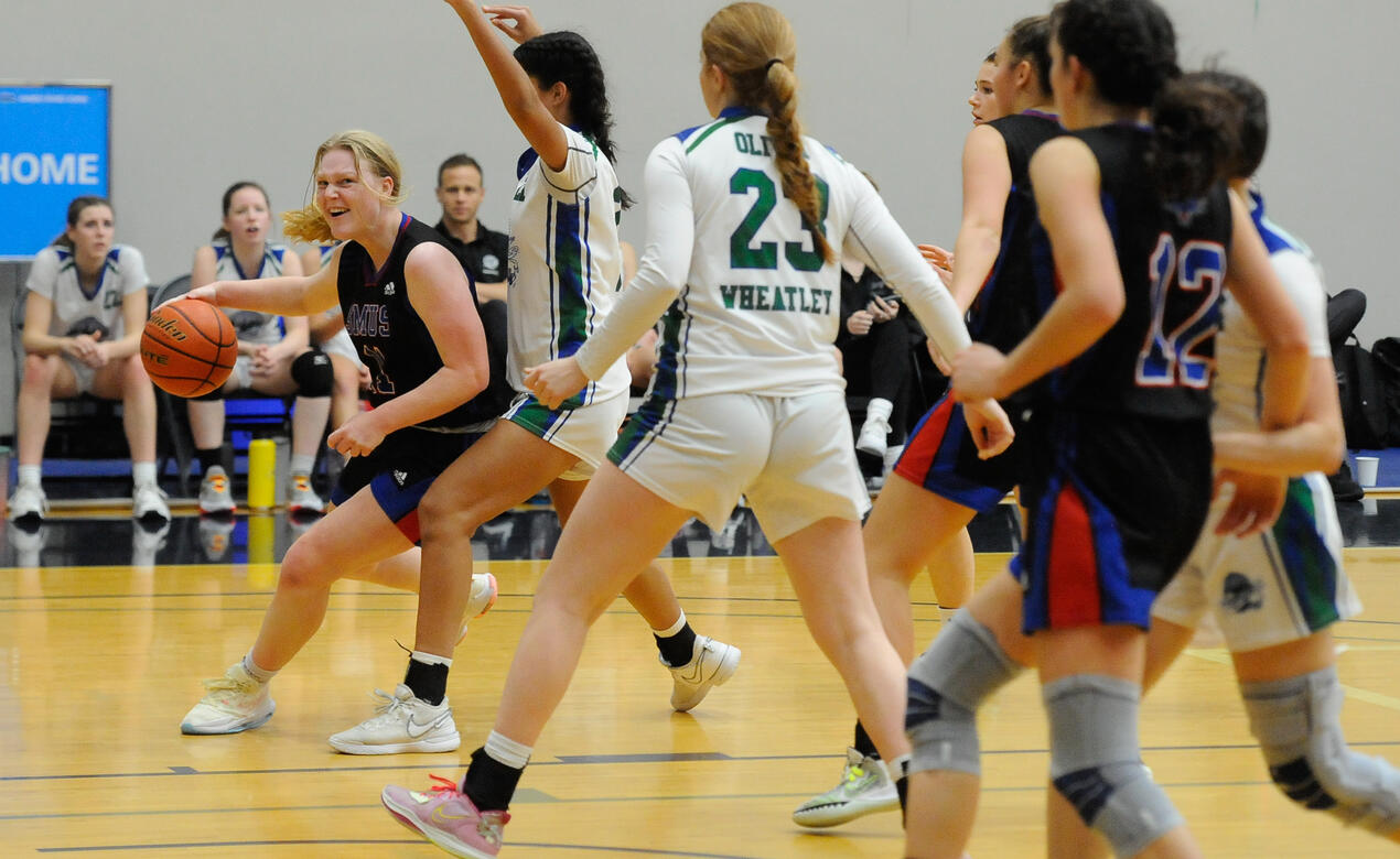 A player winds up for a shot at the hoop