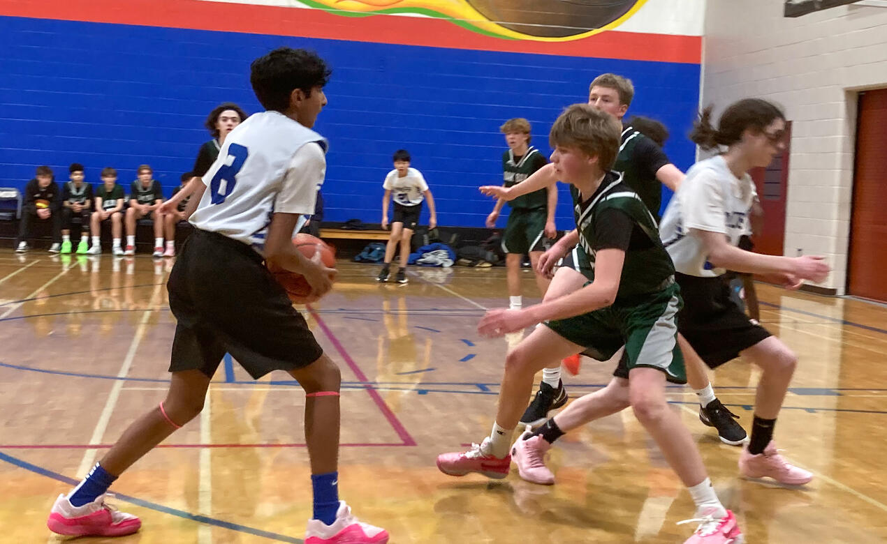 A SMUS student looks to pass against Oak Bay