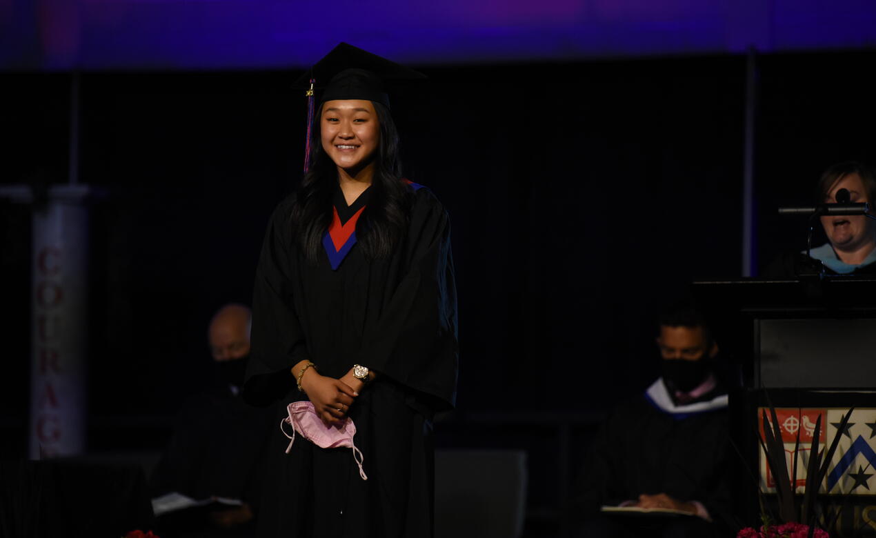 Chanel Khuu stands during graduation