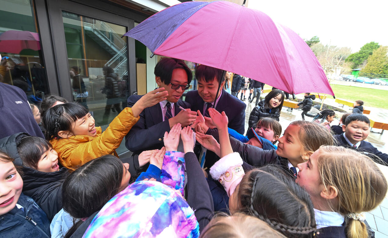 Senior School students sign autographs for Junior School students