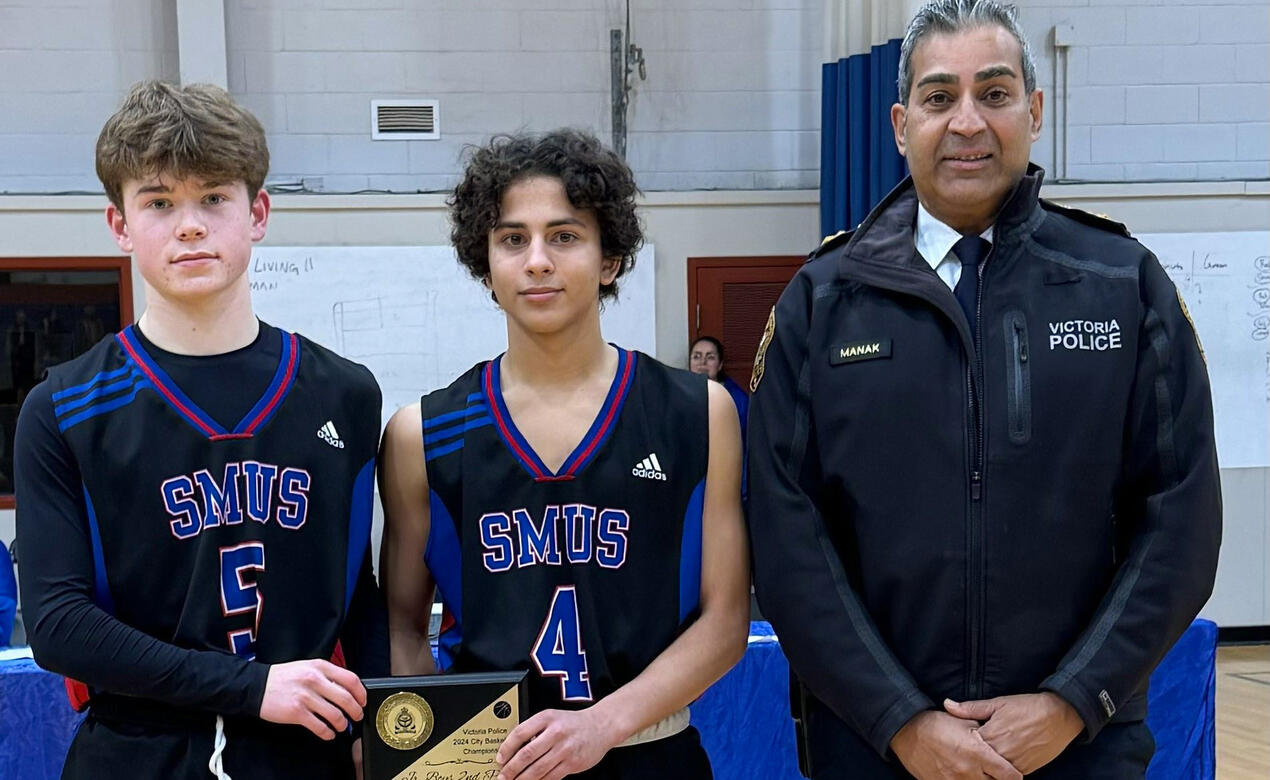 Two players accept the Award for 2nd place in the Victoria City Police Tournament