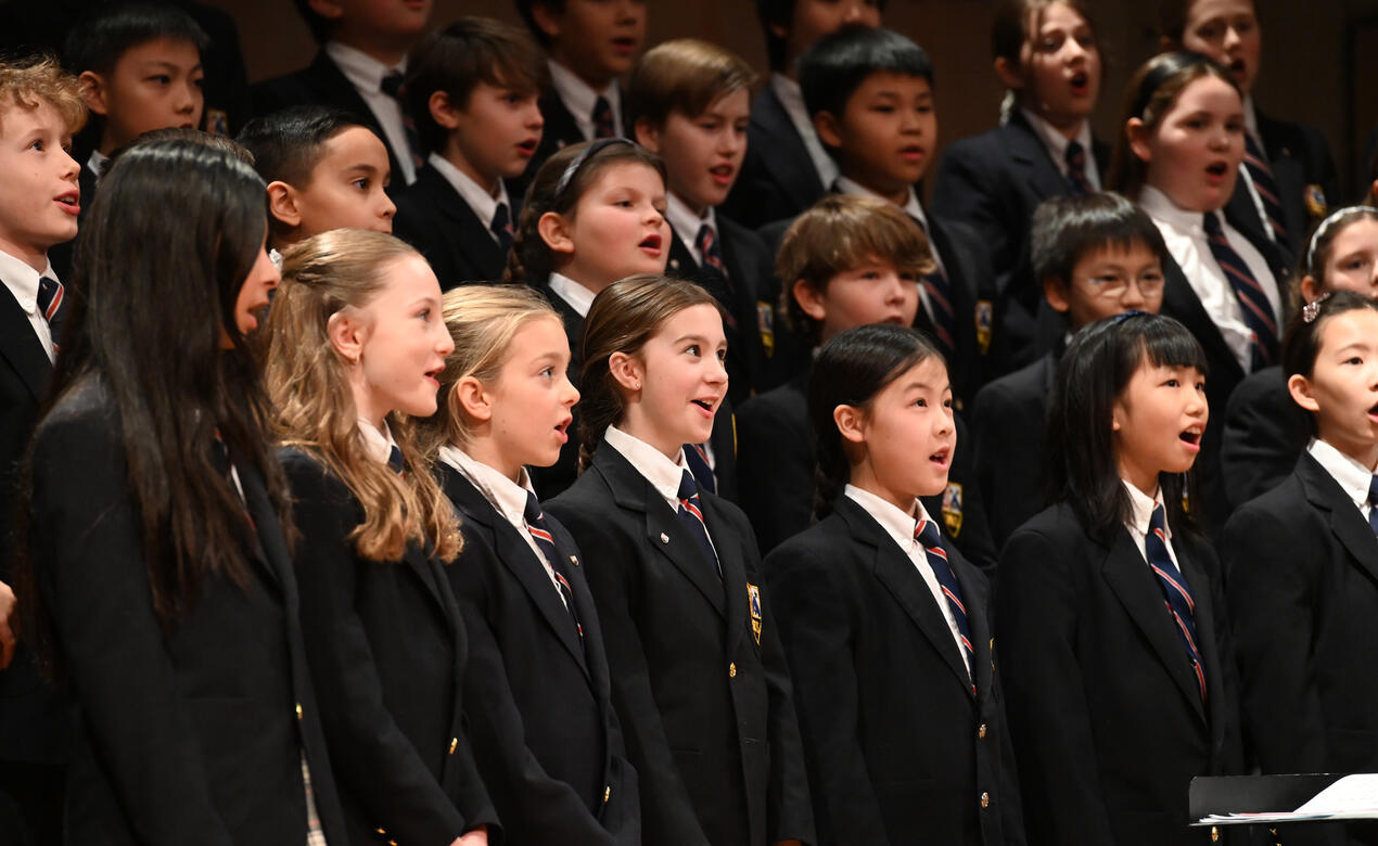 Junior School students singing on stage