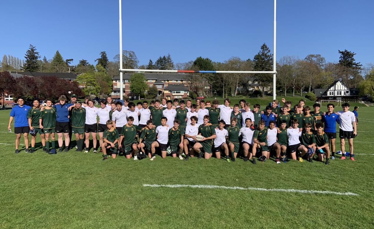 SMUS and Central Coast Grammar players stand together after the game