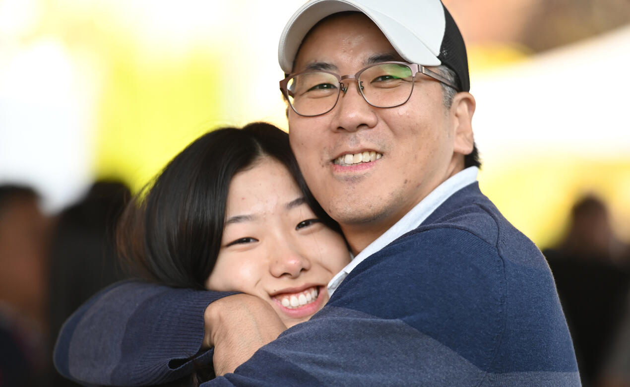 NBO Student gets hug from Father