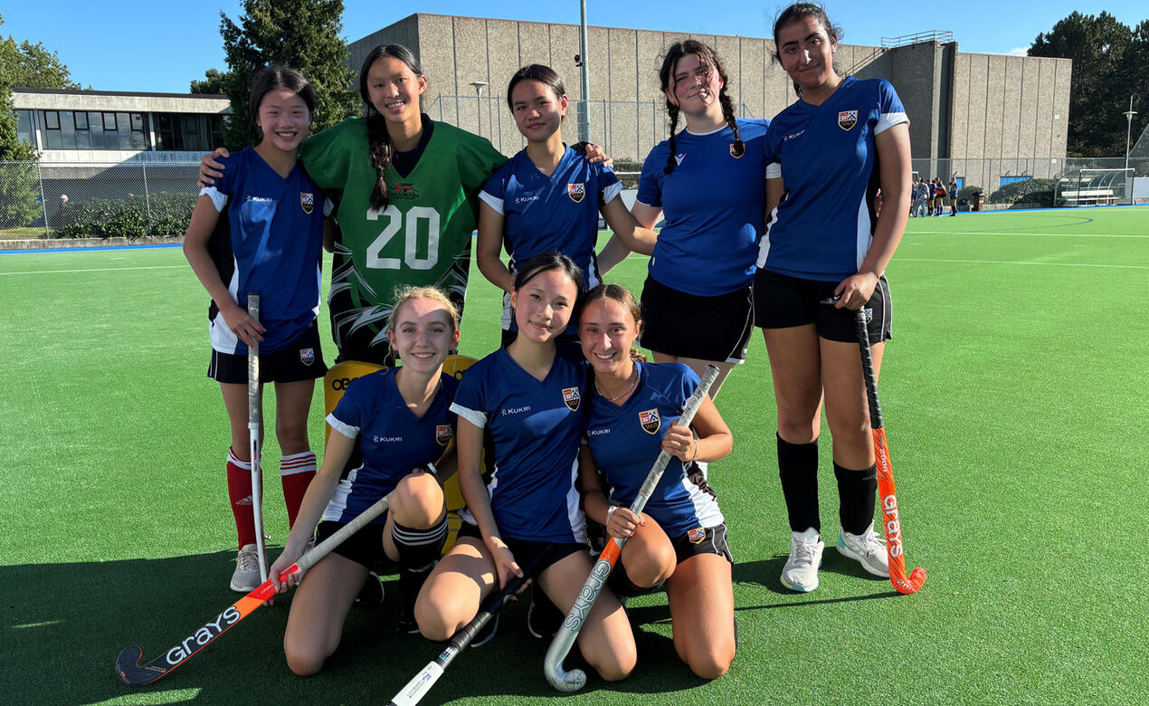 8 development team players pose after a game