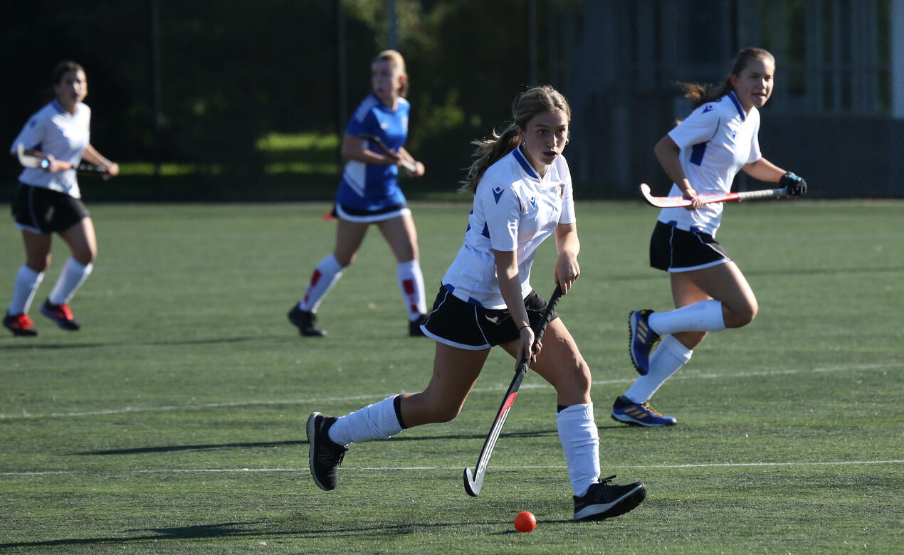 A SMUS player dribbles the ball on attack