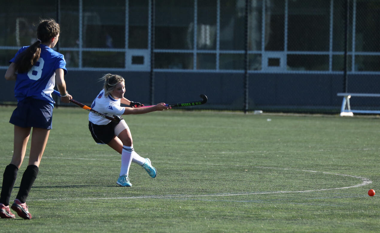 A SMUS player takes a shot at goal