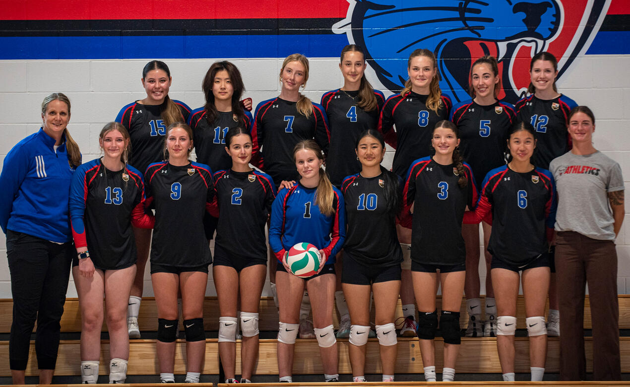 The Senior Girls Volleyball team pose for a team shot