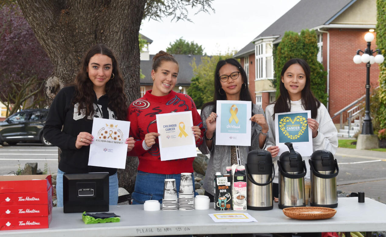 Senior School members of the Service Council sell coffee and donuts to raise funds for childhood cancer