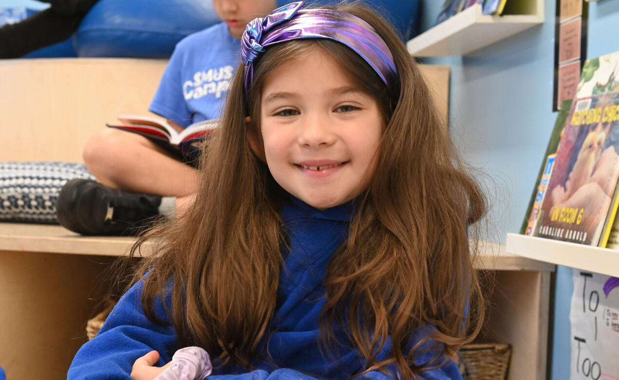 Junior School student Naia smiles in class