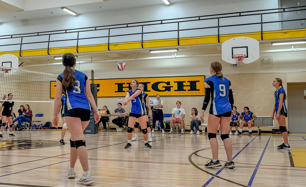 Players watch as the ball is set for a kill