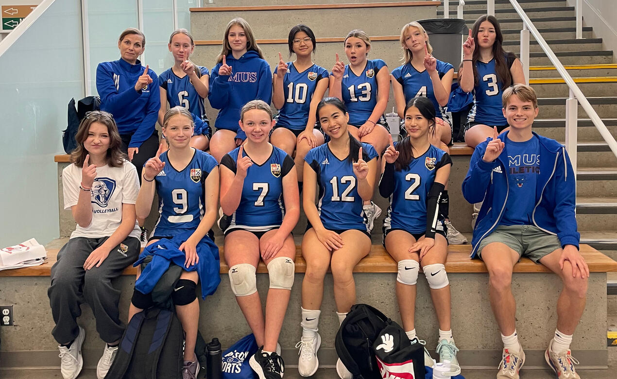 Team players smiling in celebration after winning