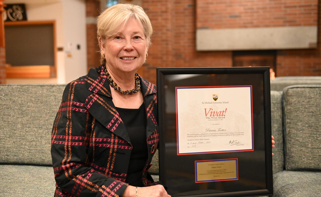 Pat Trottier with a framed copy of the Vivat Award