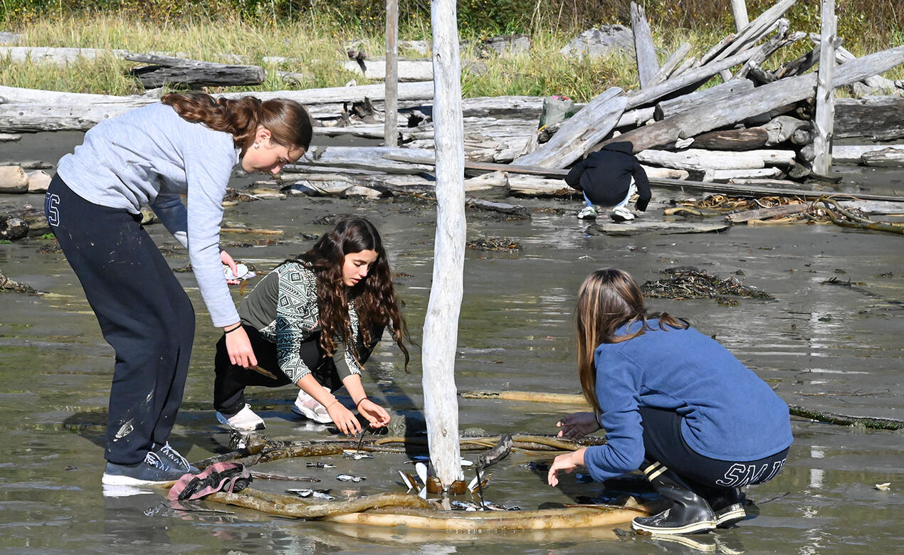 Grade 10 students create art on the beach in Tofino