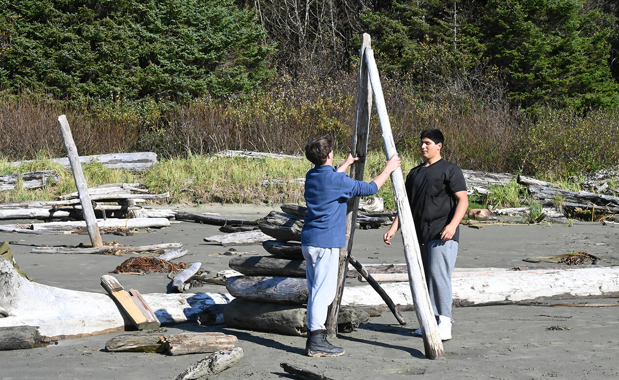 Grade 10 students create art on the beach in Tofino