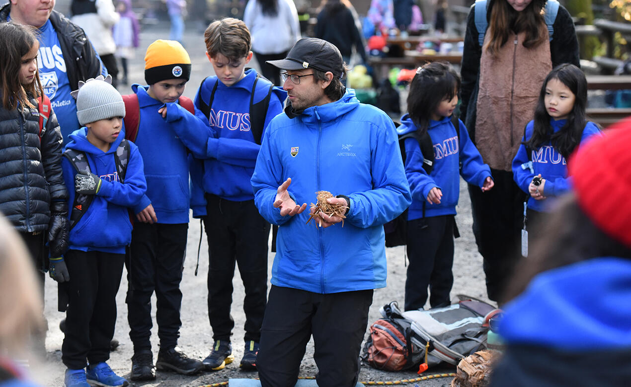 Jamie Pope teaches Grade 3 students how to build a fire at Goldstream Park